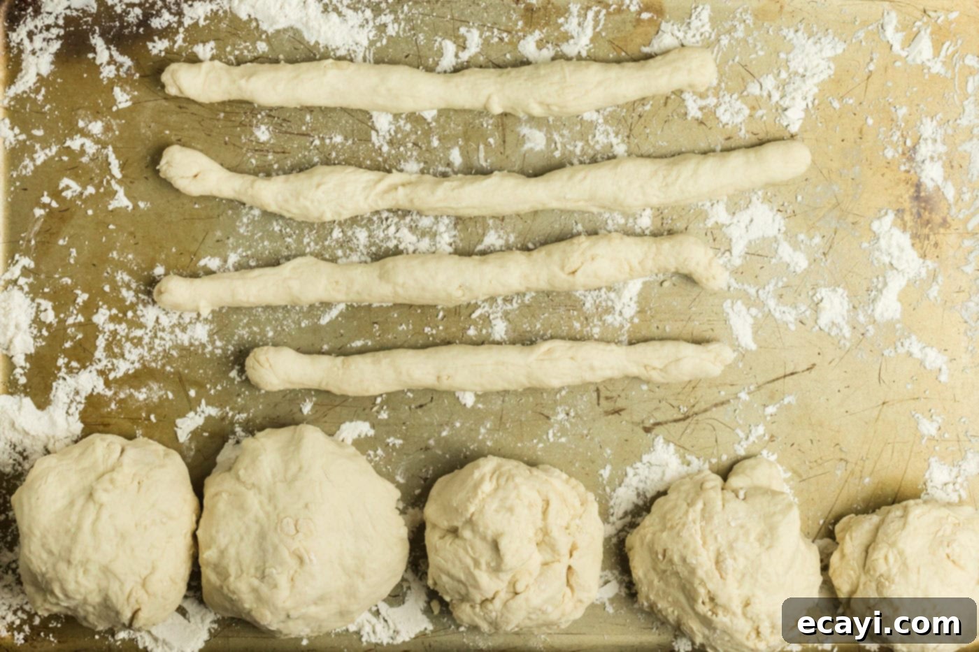 Perfectly Poppable Air Fried Pretzels 10 Ropes of dough and dough balls on a floured baking sheet