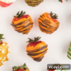 Harvest Chocolate-Dipped Strawberries 2 Three orange and brown chocolate covered strawberries on a platter