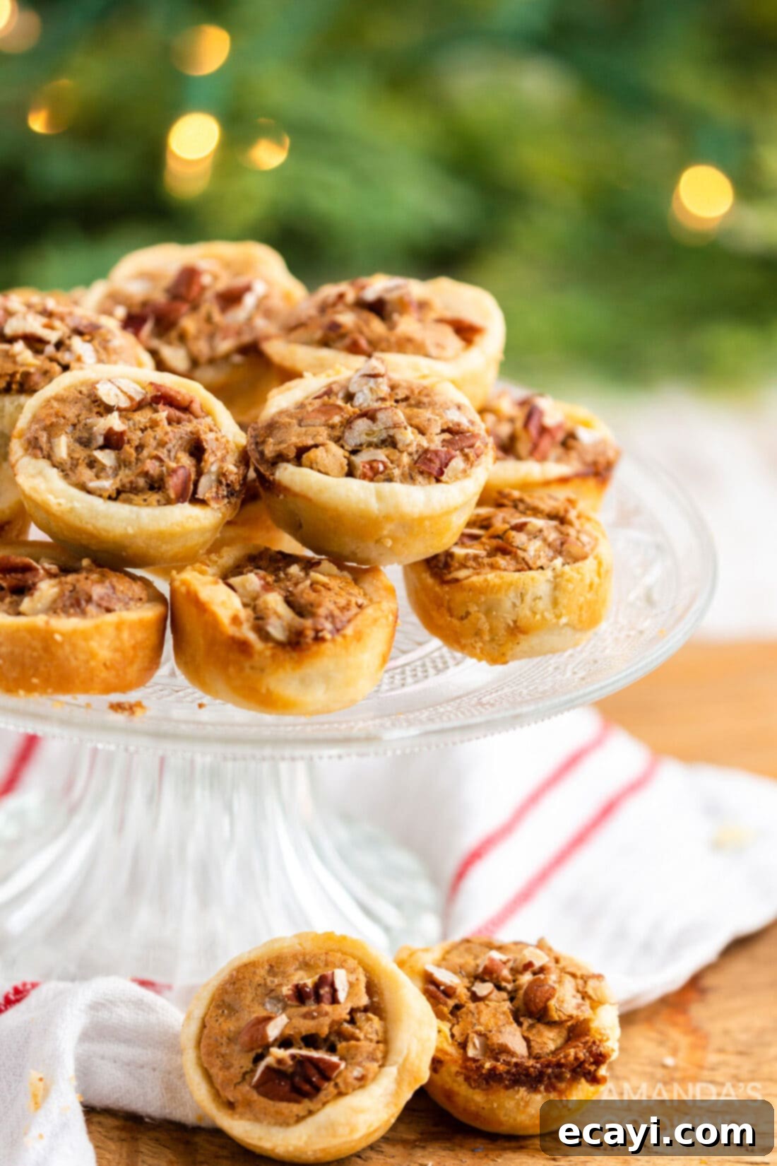 Bite-Sized Pecan Delights 2 PECAN TASSIES ON A CAKE PLATE