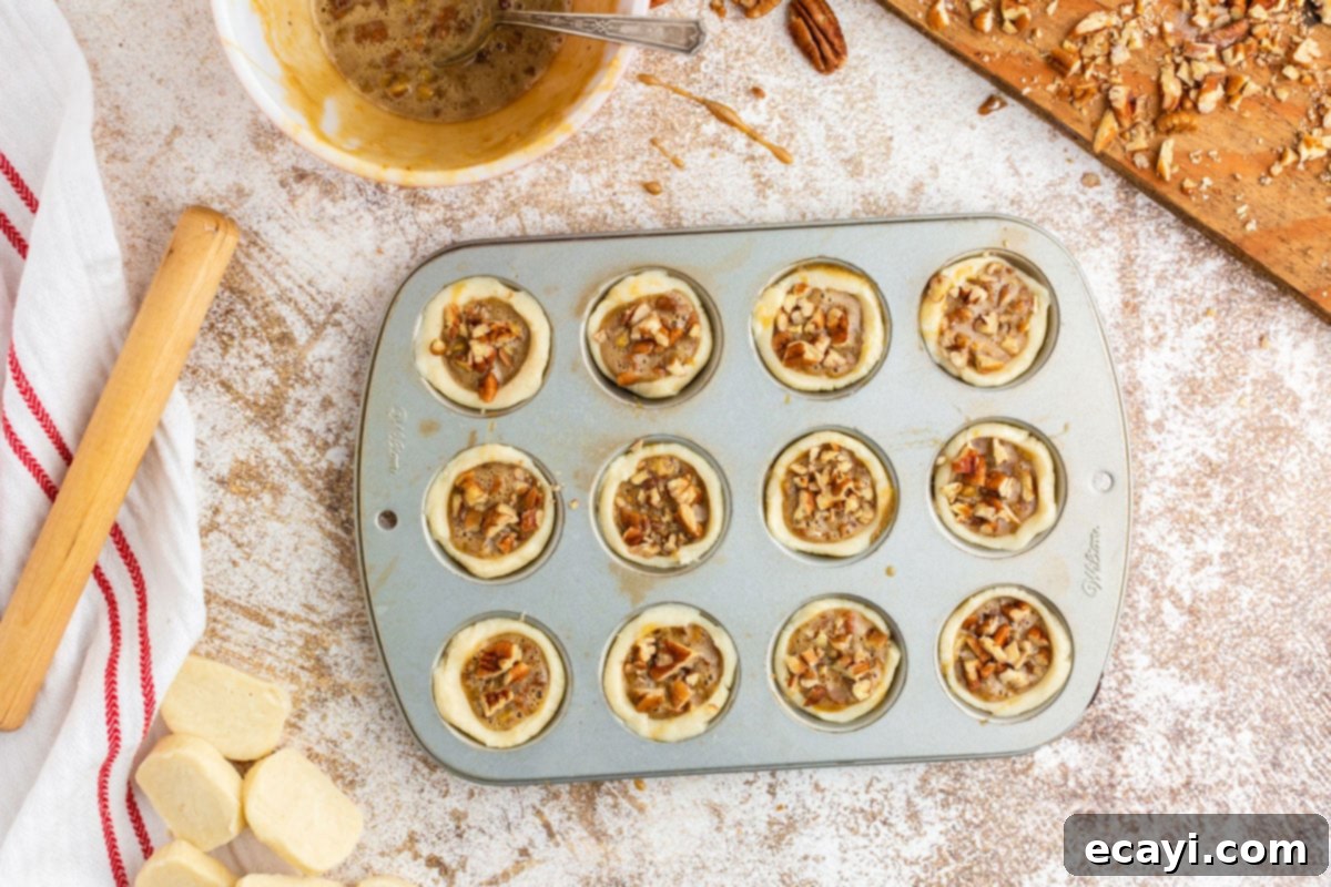Bite-Sized Pecan Delights 11 unbaked pecan tassies in a muffin tin