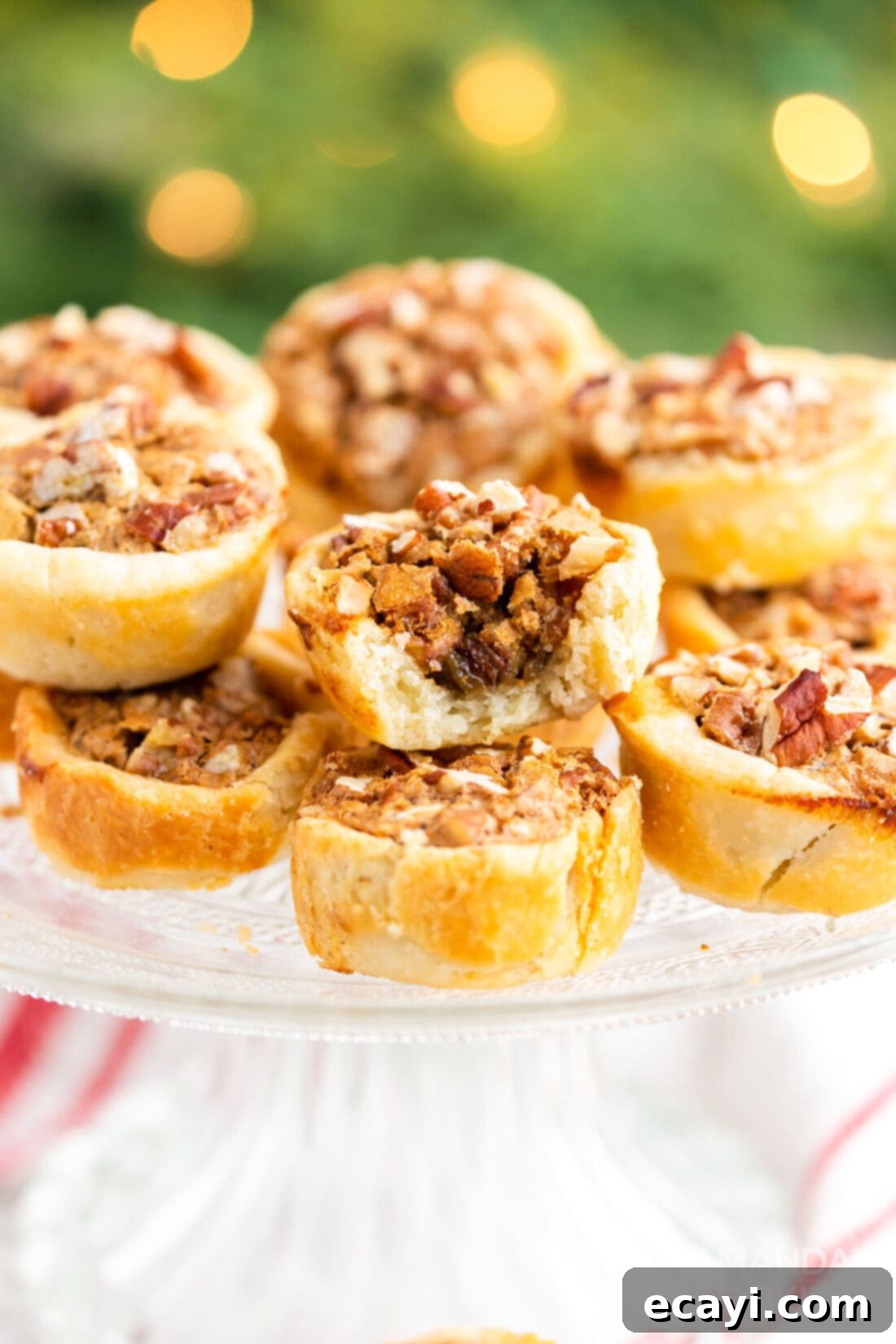 Bite-Sized Pecan Delights 13 pecan tassie with a bite out of it