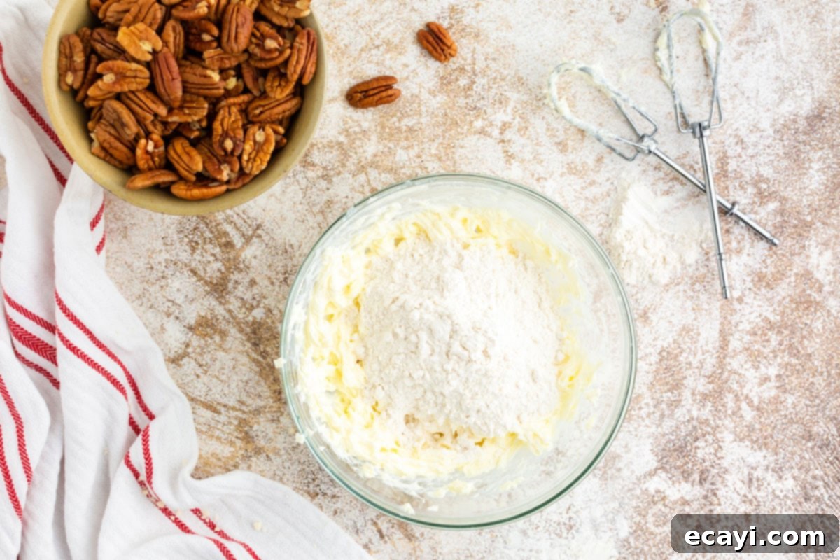 Bite-Sized Pecan Delights 5 flour in a bowl of dough