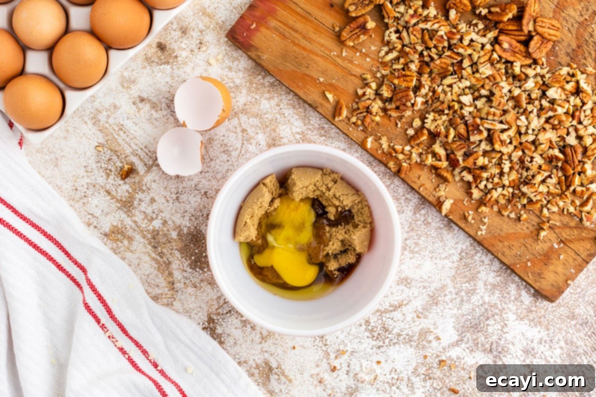 Bite-Sized Pecan Delights 7 egg in a bowl with brown sugar