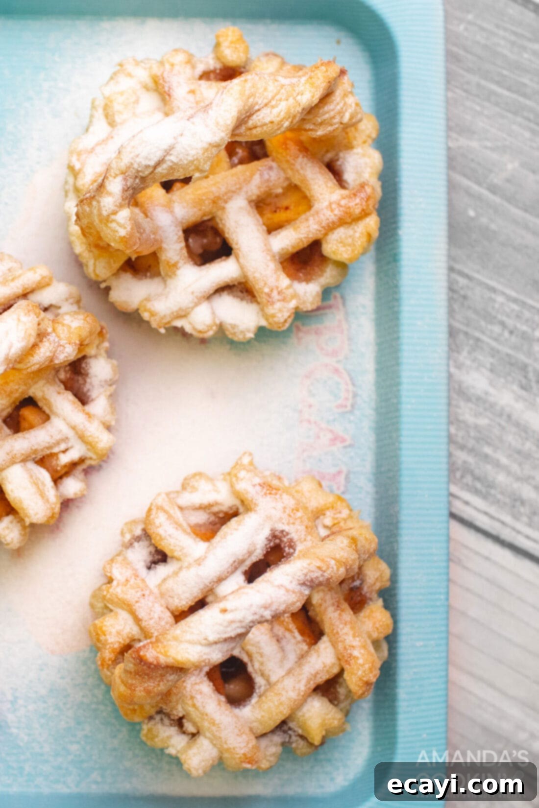 Petite Apple Pies 13 overhead photo of mini apple pies on a blue platter
