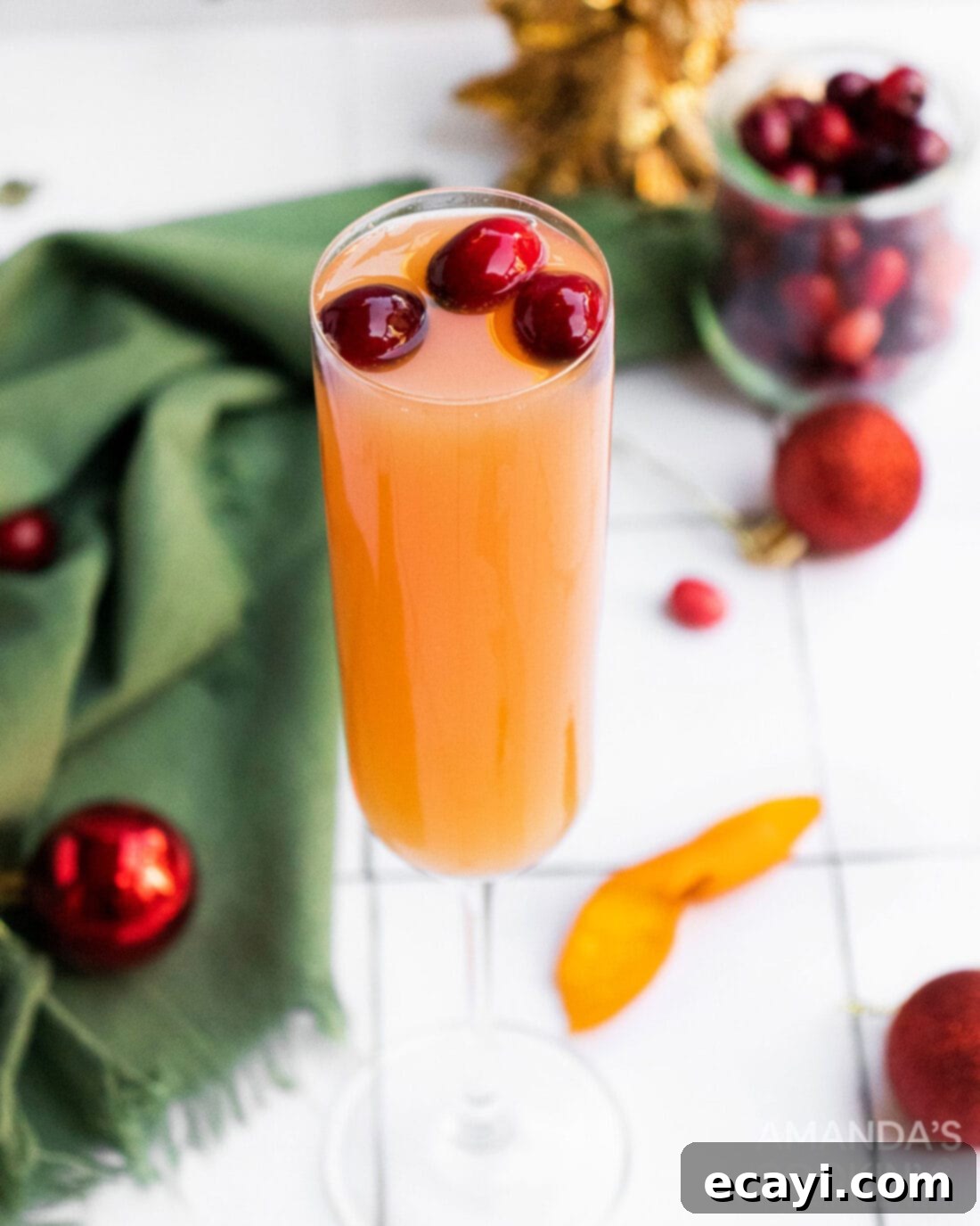 Sparkling Cranberry Mimosa 2 Elegant cranberry mimosa cocktail garnished with fresh cranberries, ready for holiday celebrations