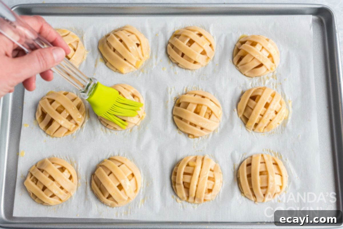 Apple Pie Delights 13 brushing the top of the apple pie cookies with egg wash before baking