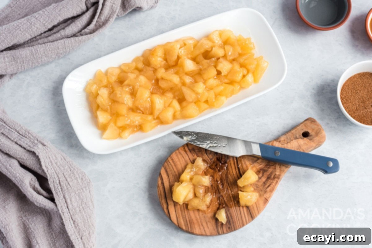 Apple Pie Delights 5 apple pie filling, a cutting board, and a knife, showing apples being cut into smaller pieces