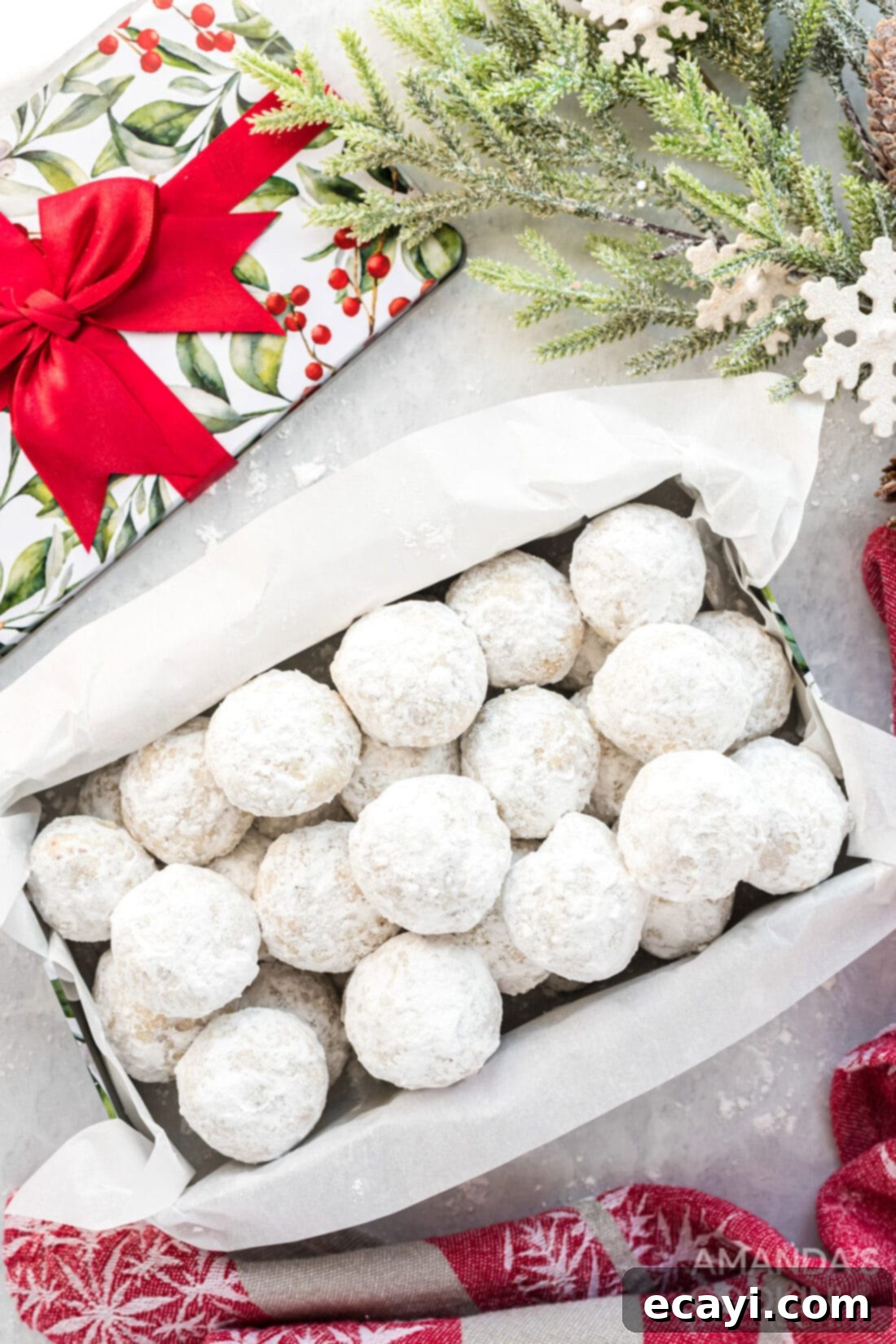 Snowball Cookies 2 Festive snowball cookies artfully arranged in a holiday gift box, perfect for sharing as edible gifts