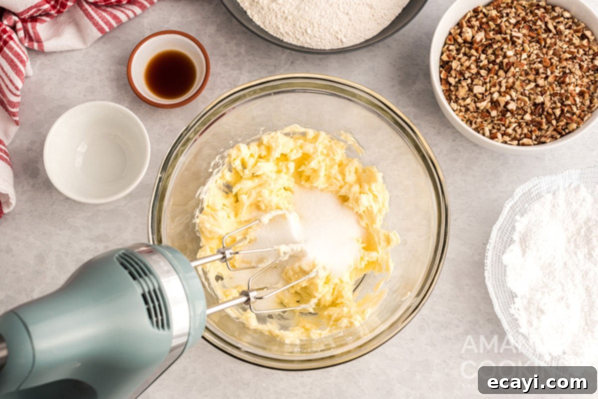 Snowball Cookies 5 Creaming softened unsalted butter and granulated sugar together in a mixing bowl with an electric hand mixer