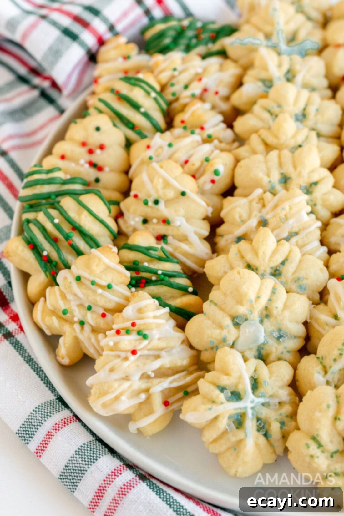 Spritz Cookies 14 A charming plate laden with an assortment of homemade Spritz cookies, beautifully arranged for a holiday celebration.