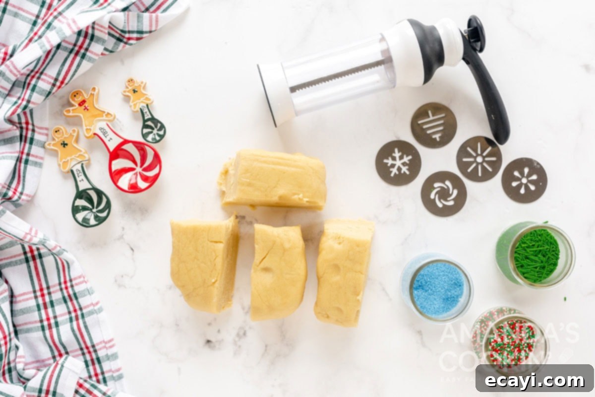 Spritz Cookies 6 Chilled Spritz cookie dough portioned into manageable pieces, ready to be loaded into the cookie press.
