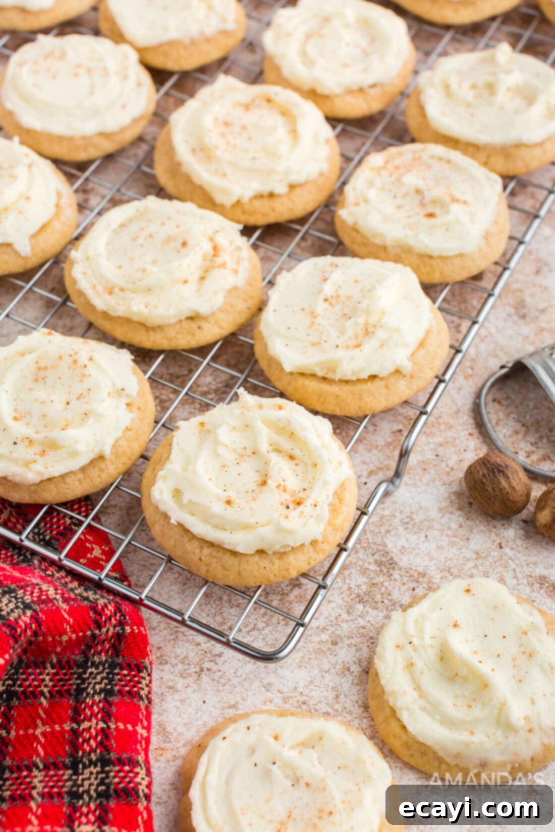Velvet Eggnog Cookies 13 Frosted eggnog cookies cooling on a wire rack, sprinkled with nutmeg