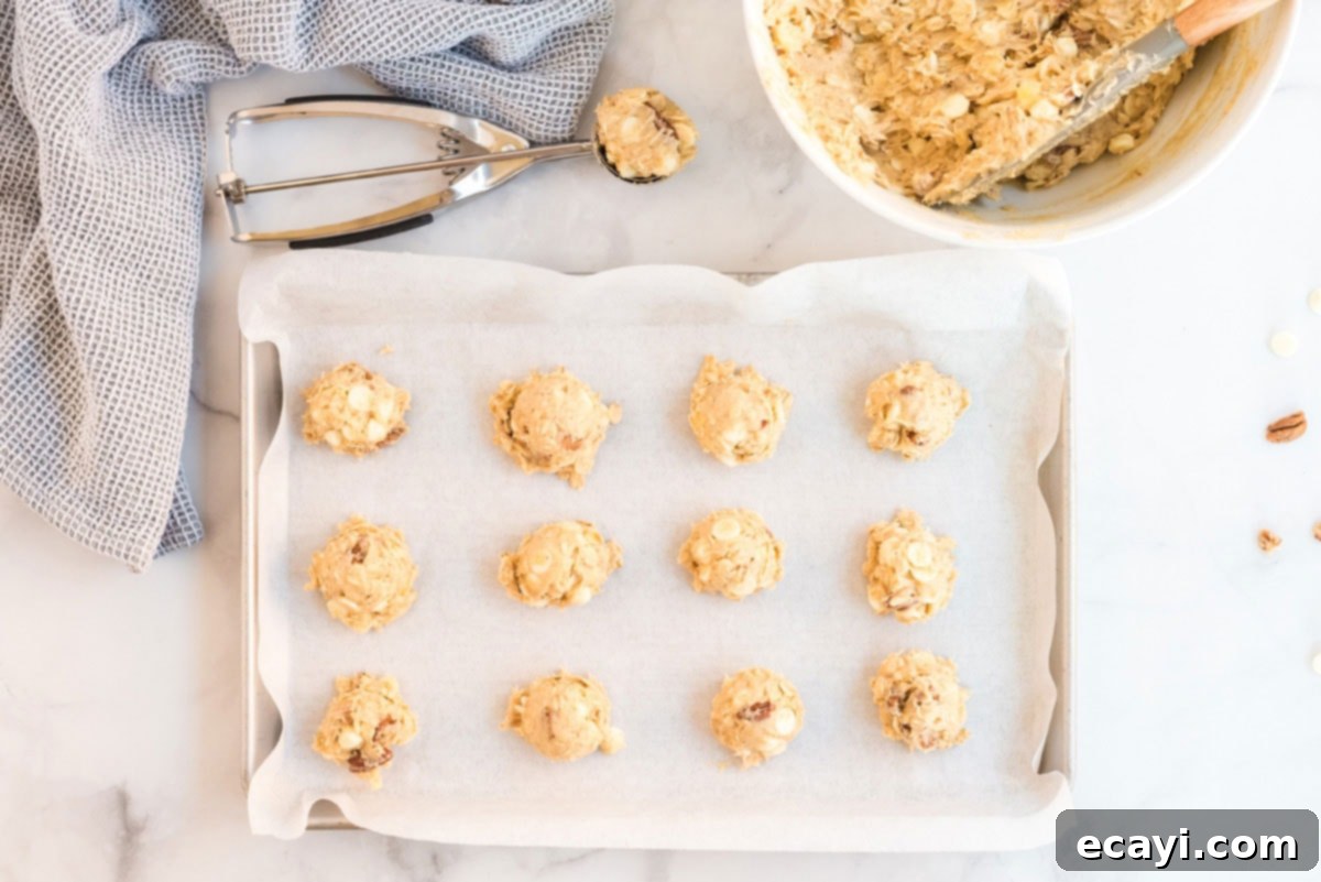 Soft-Baked Banana Cookies 11 Portioned cookie dough balls placed evenly on a baking sheet, ready for the oven