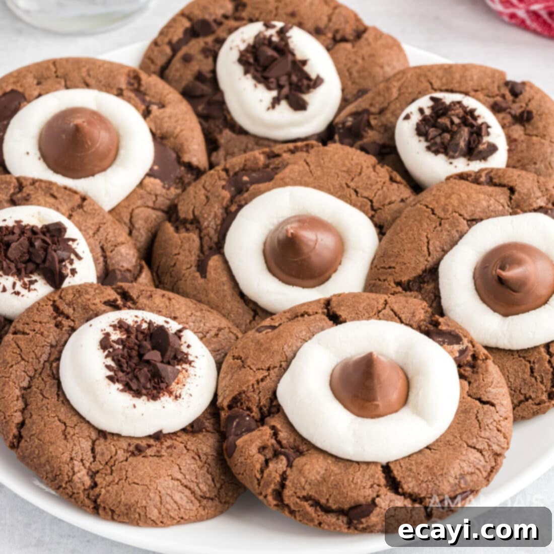 The 2020 Christmas Cookie Countdown: Twelve Days of Sweet Delights 5 Delicious hot cocoa cookies topped with mini marshmallows, arranged on a plate.