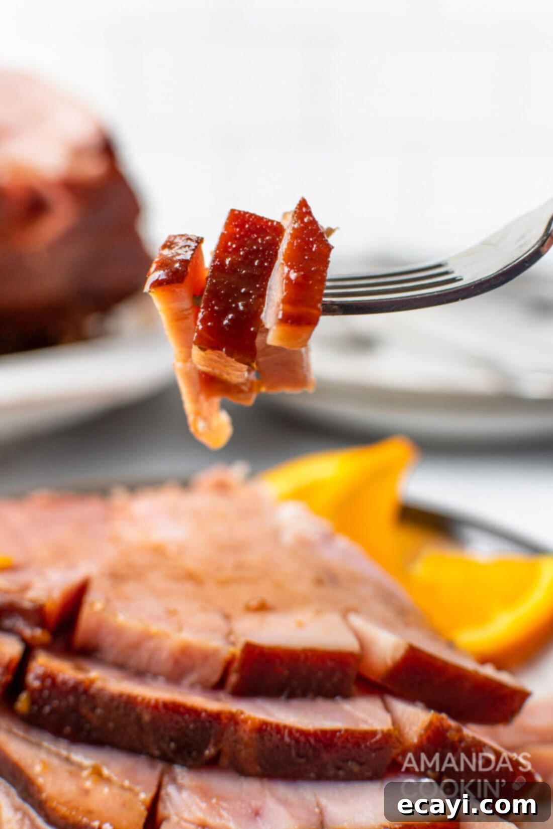 Zesty Orange Bourbon Glazed Ham 8 fork with ham slices