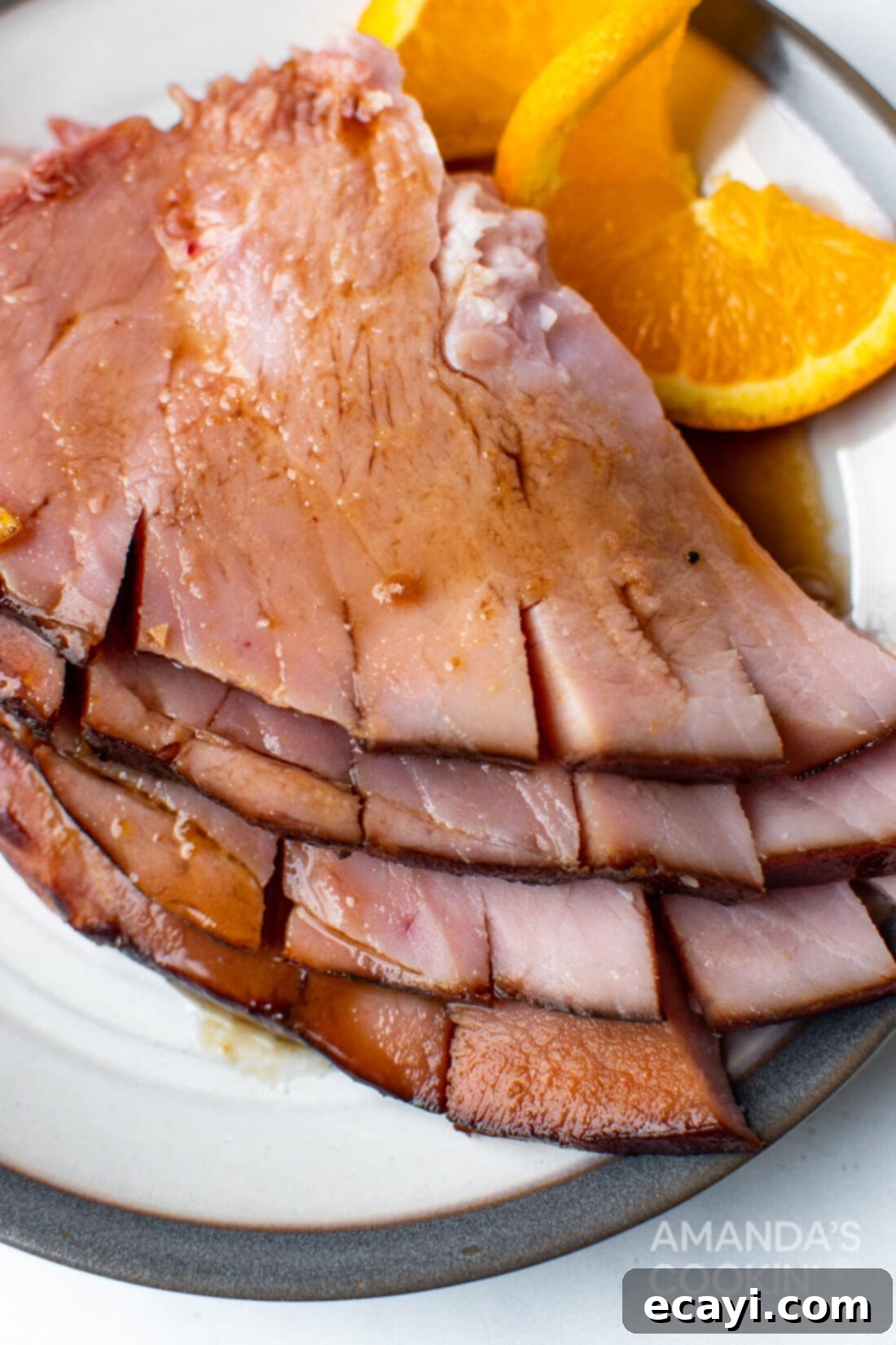 Zesty Orange Bourbon Glazed Ham 9 sliced glazed ham on plate