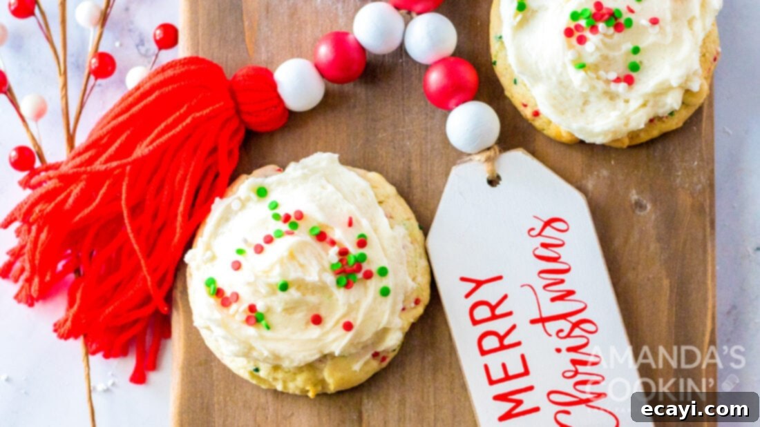 Festive Cake Batter Bites 6 Cake mix cookies with Christmas sprinkles and frosting on a wooden cutting board