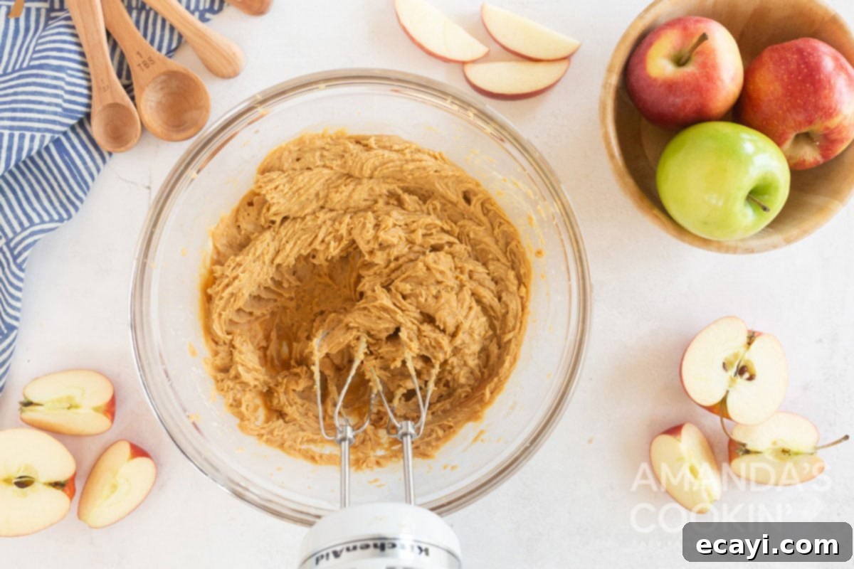 Creamy Peanut Butter Apple Delight 6 peanut butter apple dip being blended by a hand mixer