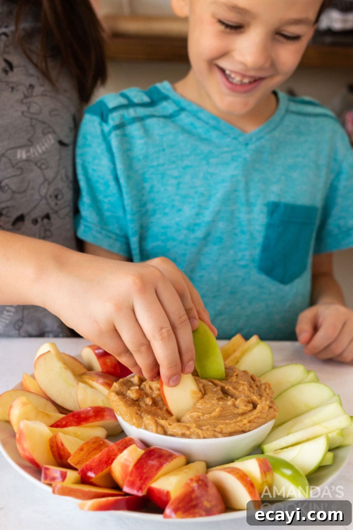 Creamy Peanut Butter Apple Delight 7 kids dipping apple slices into peanut butter fruit dip