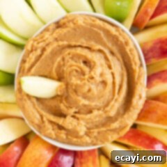 Creamy Peanut Butter Apple Delight 9 cowl of peanut butter apple dip surrounded by apples