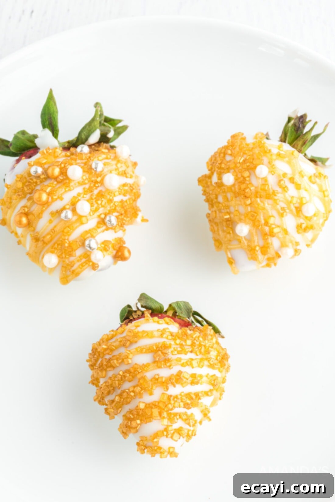 New Years Chocolate Strawberry Delights 2 decorated strawberries with gold and white chocolate, perfect for New Year's Eve