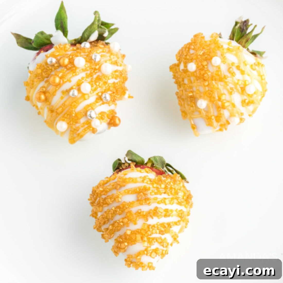New Years Chocolate Strawberry Delights 3 decorated strawberries with gold and white chocolate and sprinkles