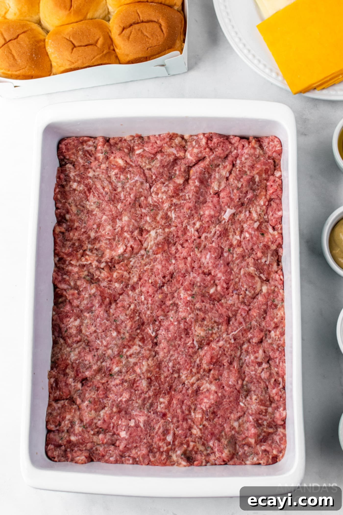Bite-Sized Cheeseburger Bliss 5 Meat mixture pressed into a baking pan