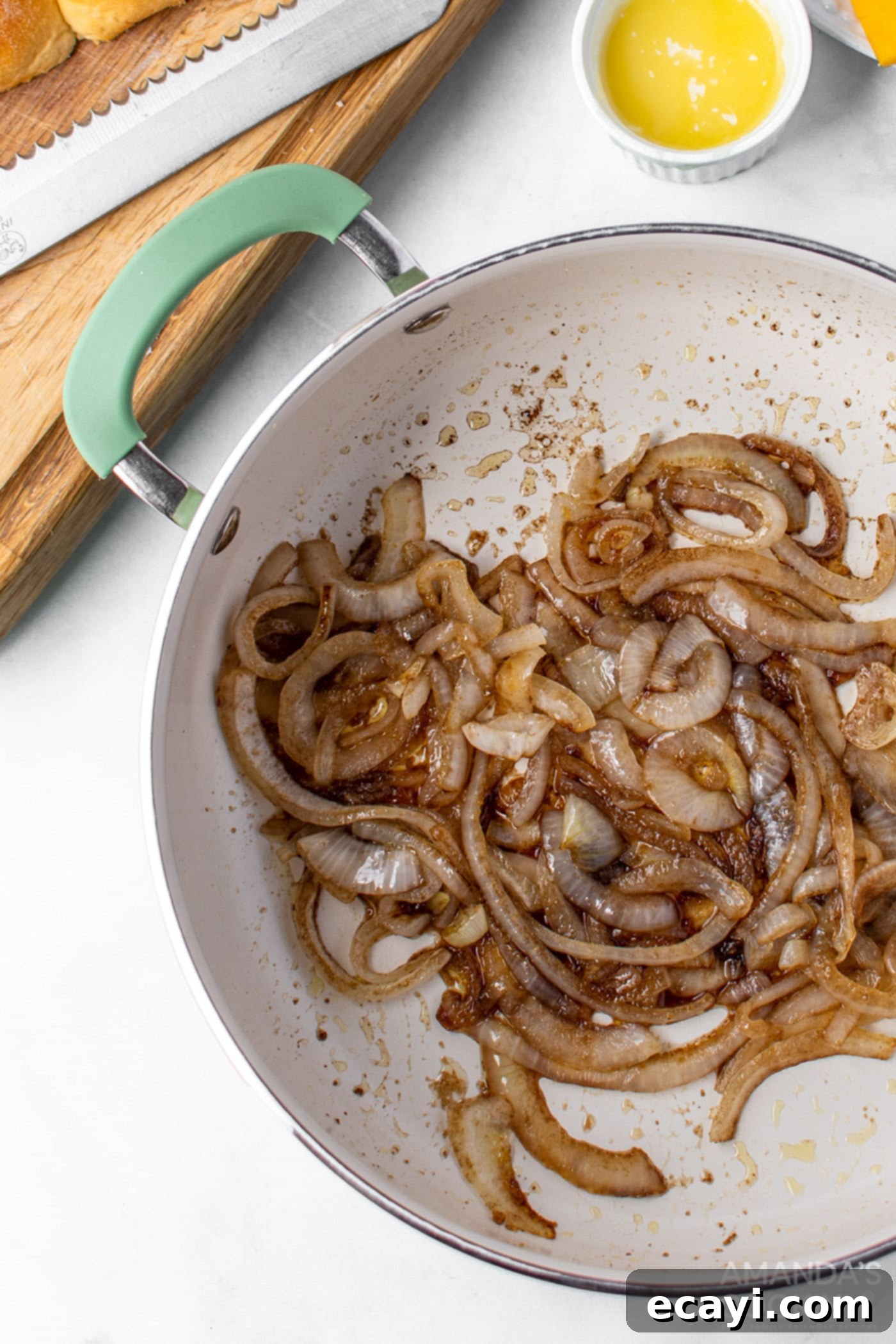 Bite-Sized Cheeseburger Bliss 6 Caramelizing onions in a skillet