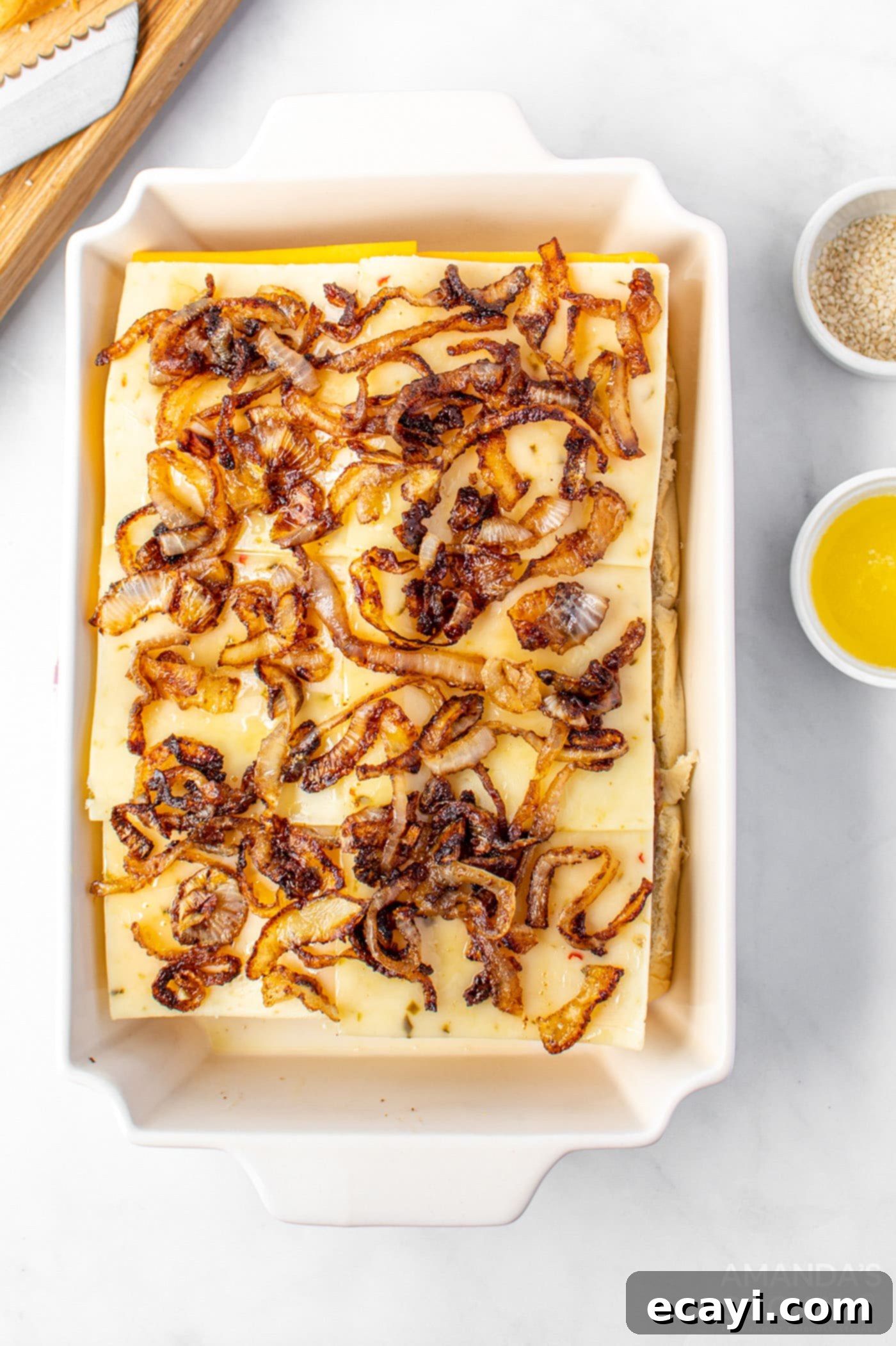 Bite-Sized Cheeseburger Bliss 9 Caramelized onions spread over cheese