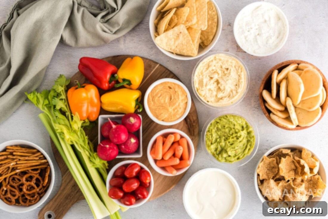 Game Day Grazing Platter 4 A collection of fresh ingredients laid out for an easy football party tray, including various dips and crunchy dippers.