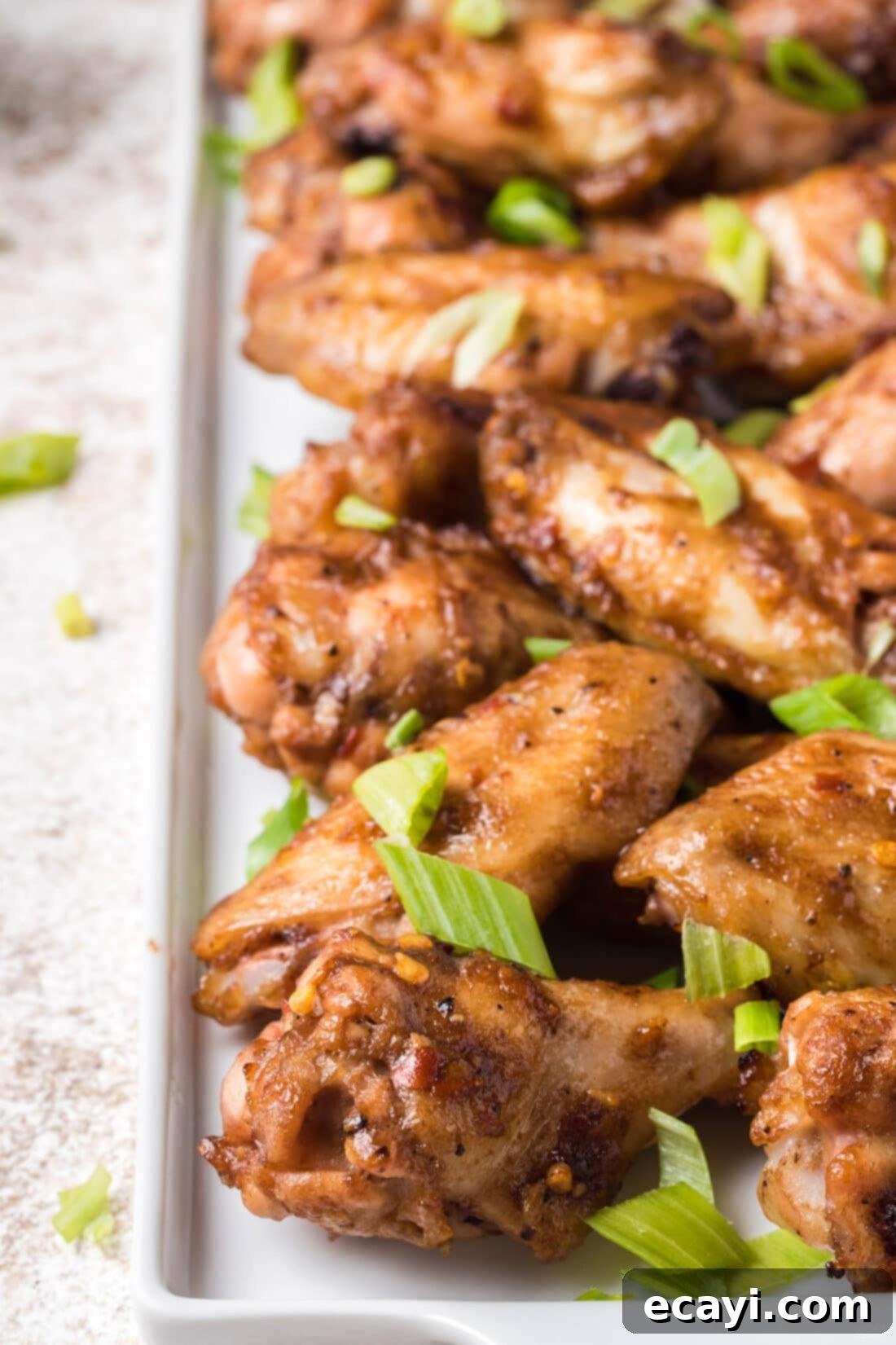 Inferno Wings 8 A plate of freshly baked, sticky, and spicy tamarind chicken wings ready to be devoured