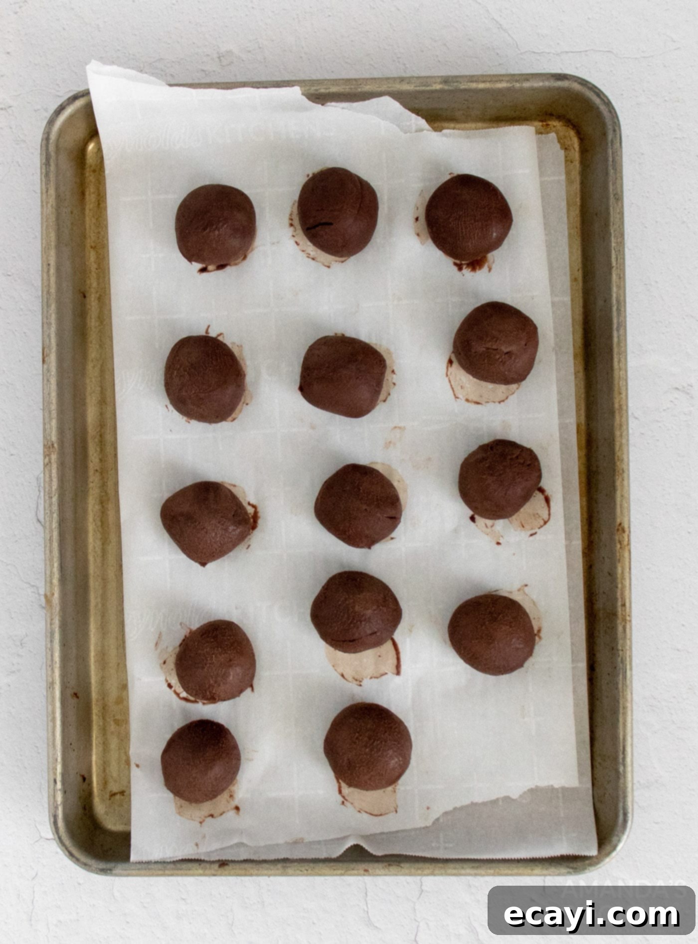 Decadent Mocha Truffles 7 Uniformly scooped mocha truffle balls neatly arranged on a parchment-lined baking sheet, chilled and ready for the next step of coating.