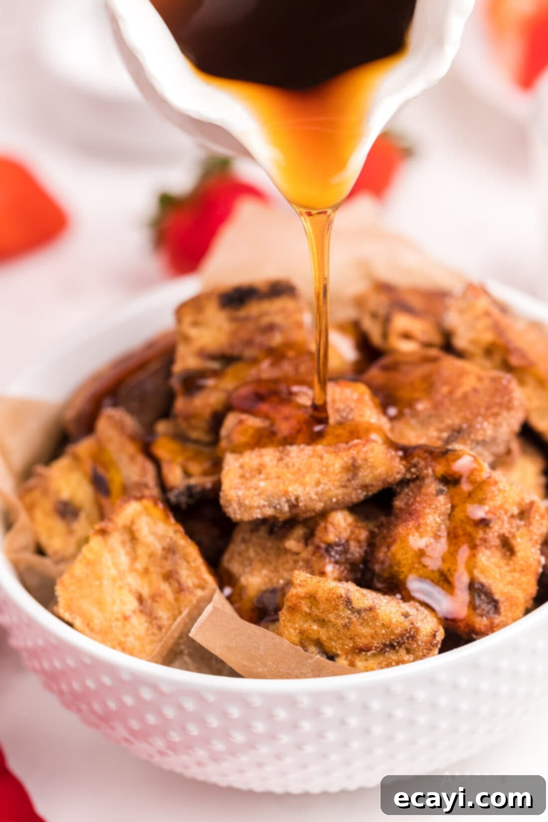 Crispy Air Fryer French Toast Bites 11 pouring syrup over Air Fryer French Toast Bites