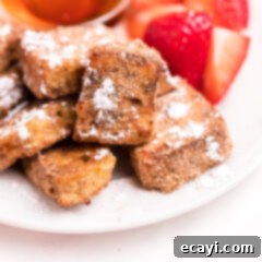 Crispy Air Fryer French Toast Bites 12 Air Fryer French toast bites on a plate