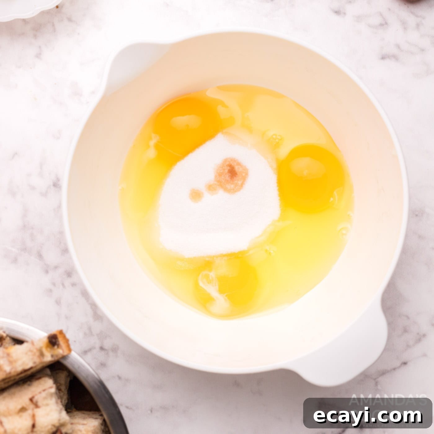Crispy Air Fryer French Toast Bites 6 eggs and sugar in a bowl