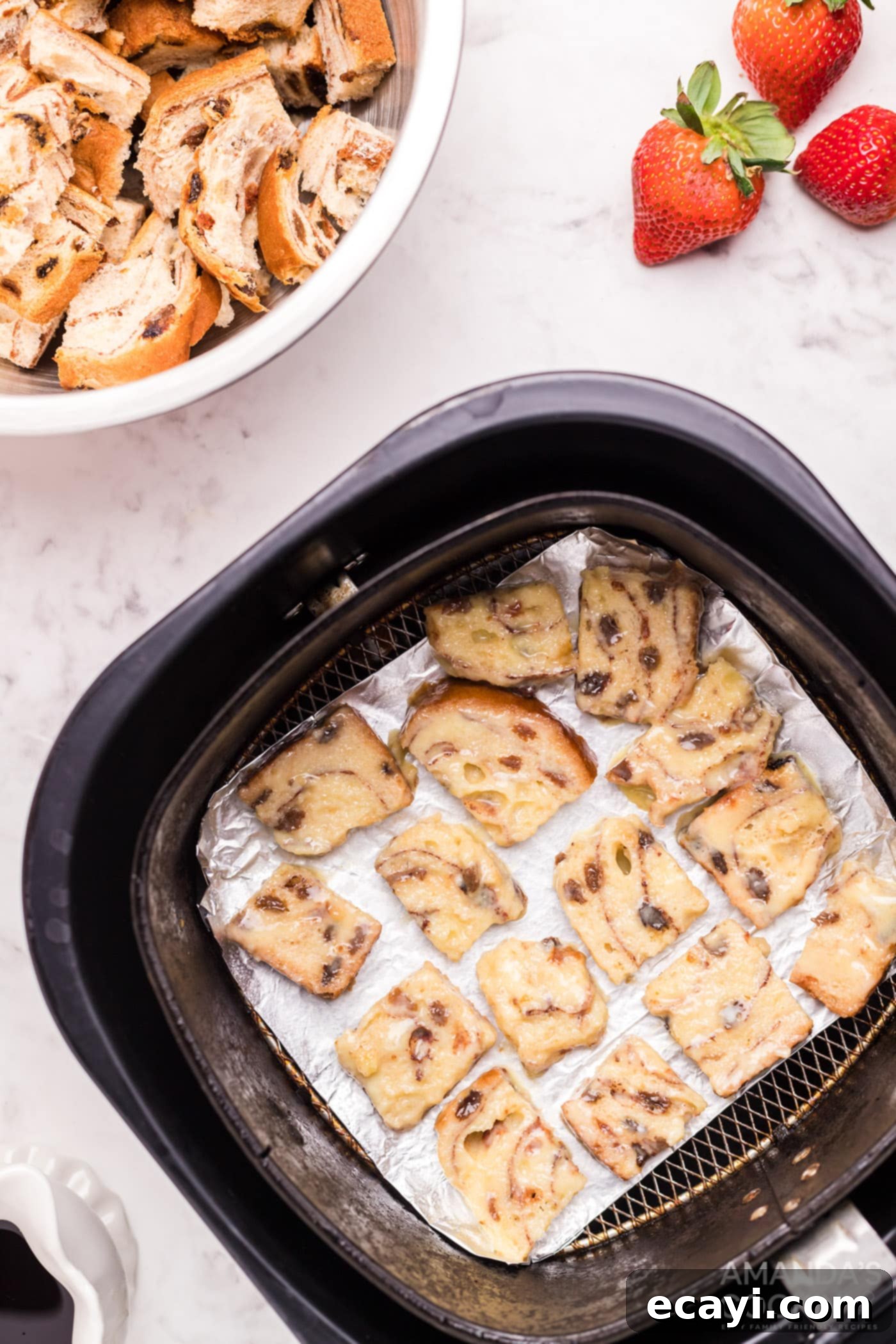 Crispy Air Fryer French Toast Bites 8 bread squares in air fryer basket