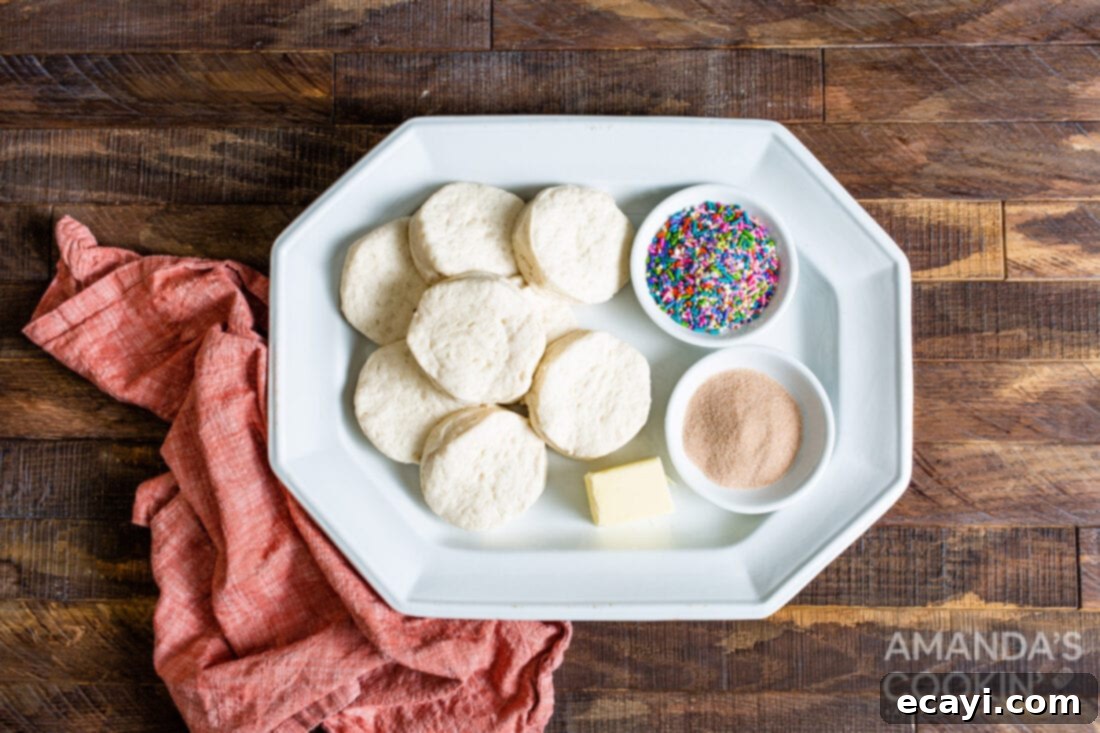 Air Fryer Donut Delights 4 A spread of fresh ingredients, including canned biscuits, butter, cinnamon, sugar, and chocolate chips, ready for making air fryer donuts.