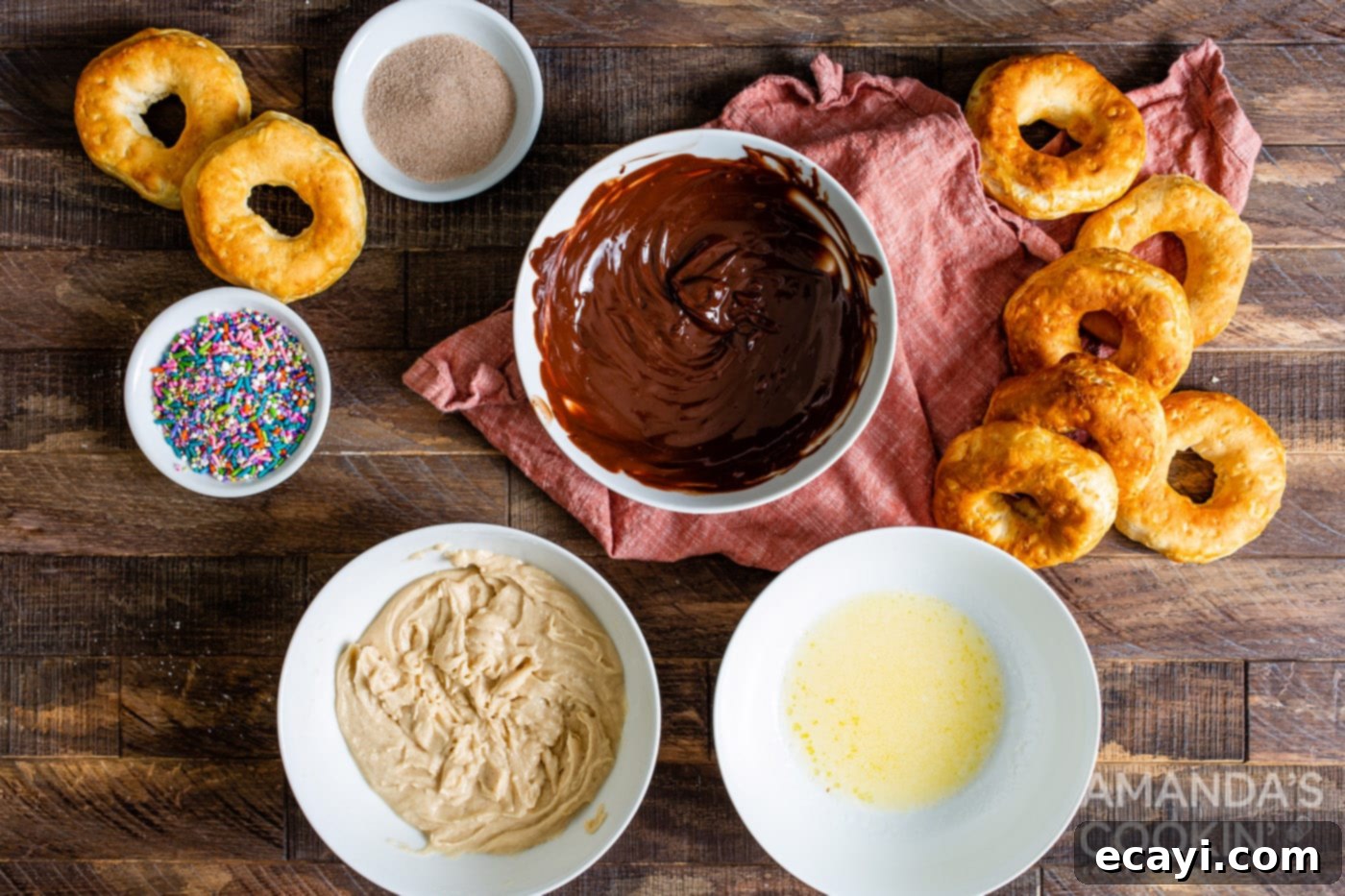 Air Fryer Donut Delights 6 Three small bowls showcasing different donut toppings: melted butter, cinnamon sugar mix, and chocolate chips.