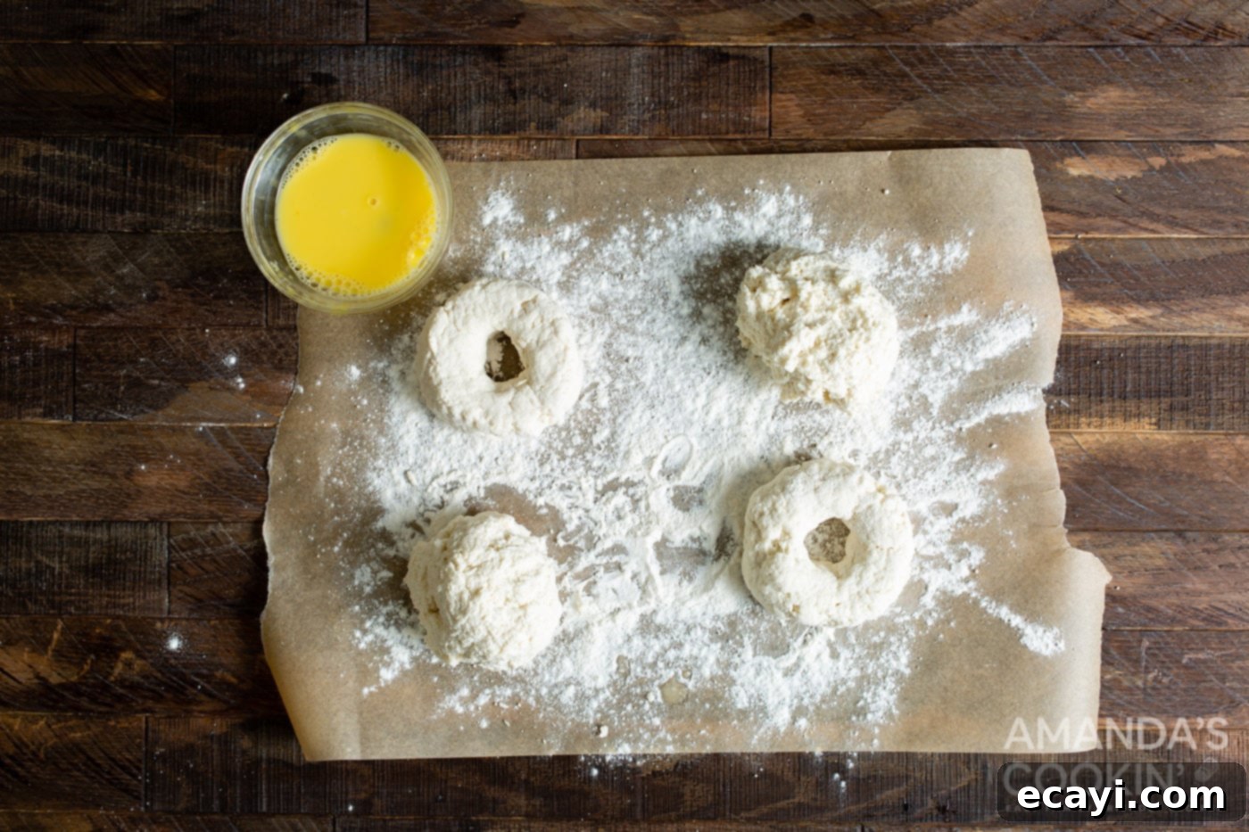 Bagel Magic in the Air Fryer 6 raw air fryer bagels on parchment with flour