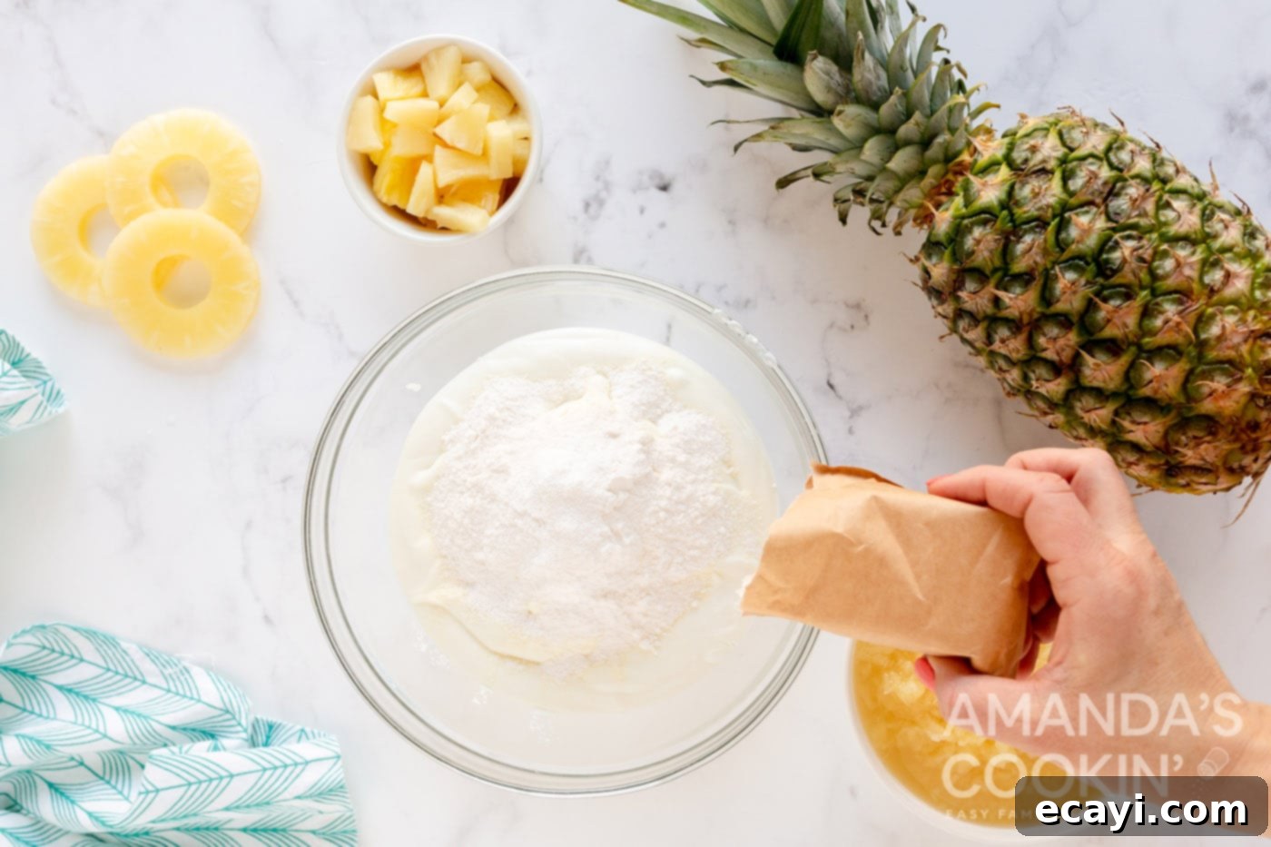 Golden Pineapple Yogurt Cloud 5 adding dry pudding mix to bowl with Greek yogurt