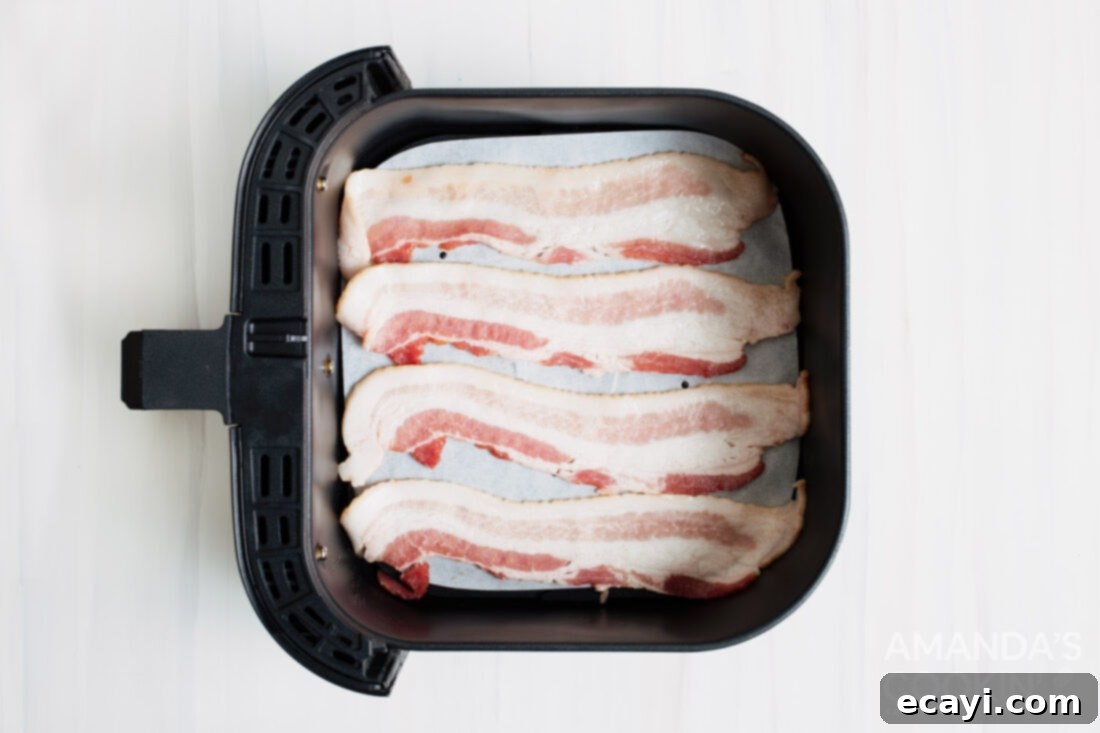 Effortless Crispy Air Fryer Bacon 4 bacon in an air fryer basket