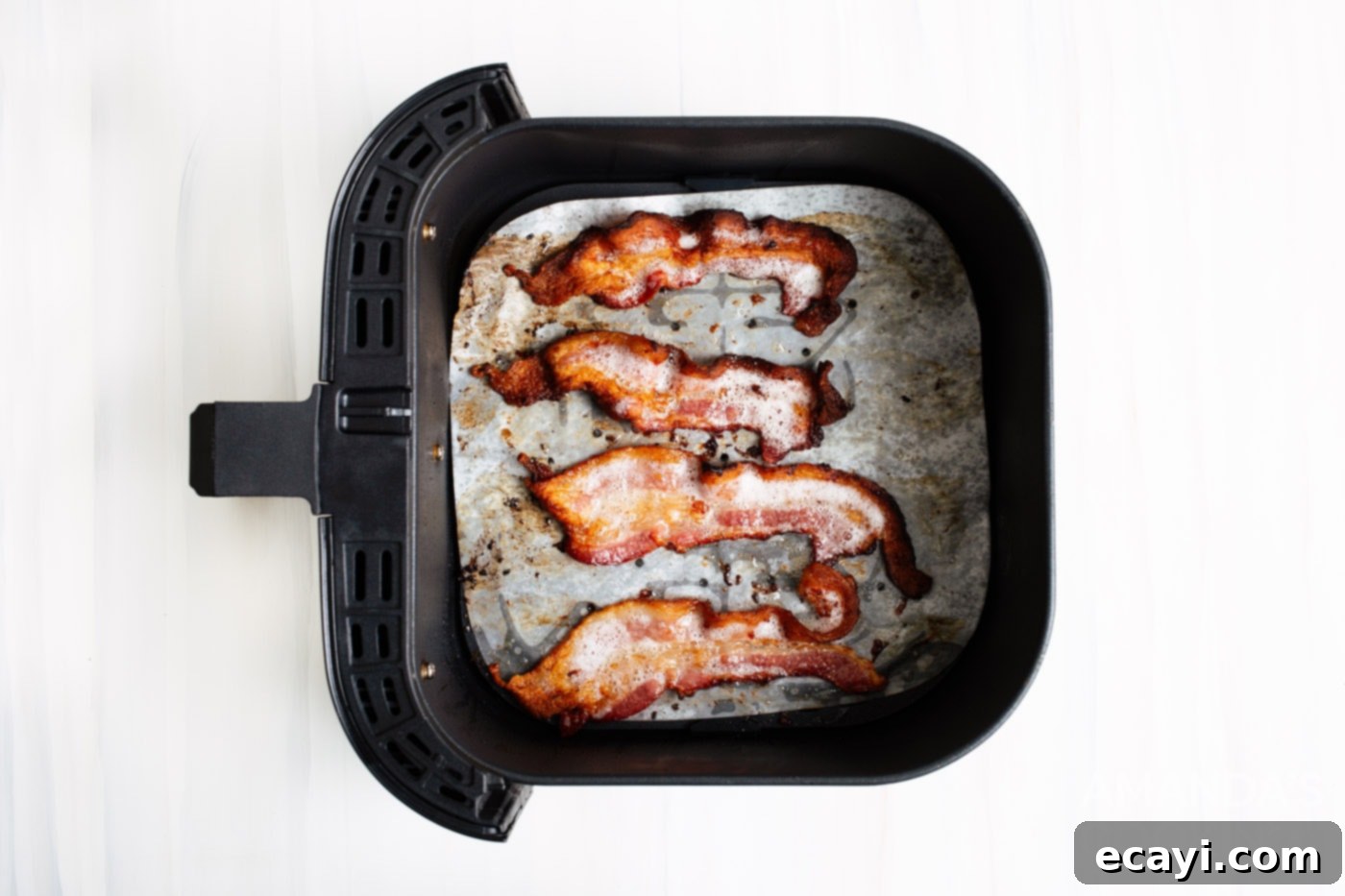 Effortless Crispy Air Fryer Bacon 5 cooked bacon in air fryer basket