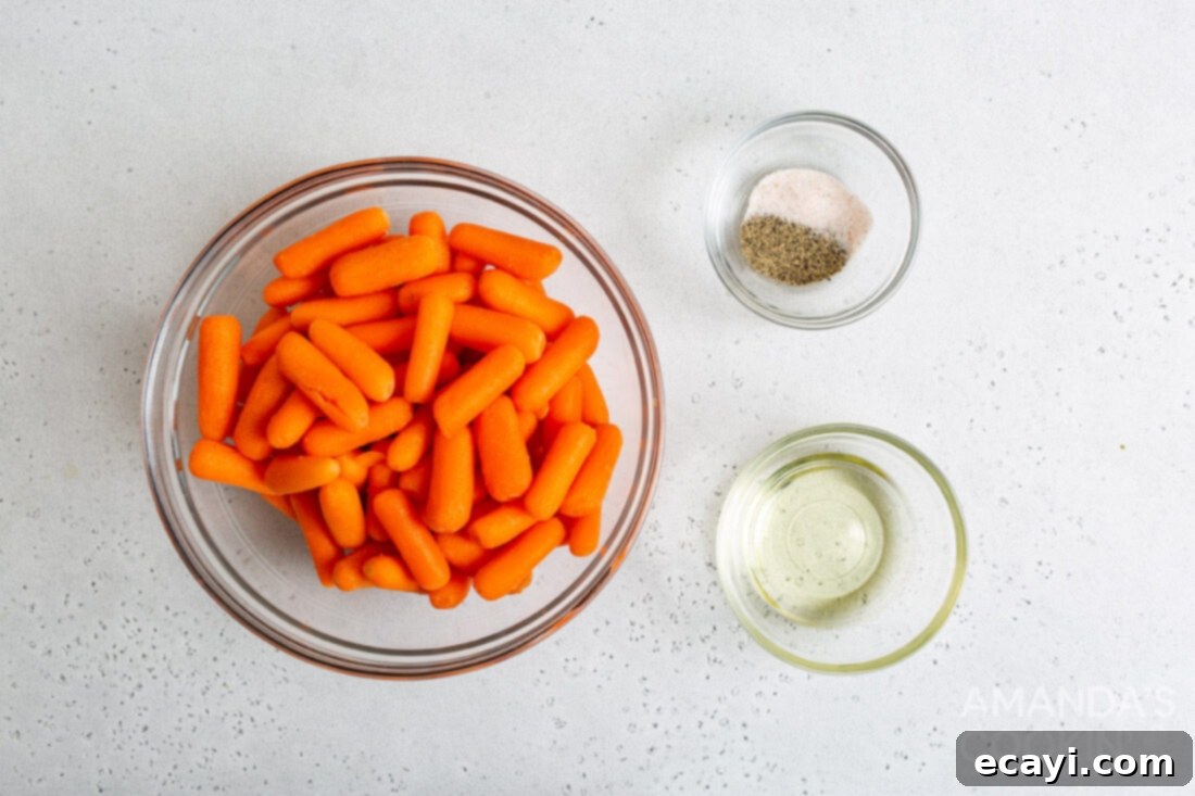 Golden Air Fryer Carrots 4 A collection of fresh ingredients laid out for making air fryer carrots, including fresh carrots, cooking oil, and simple seasonings.