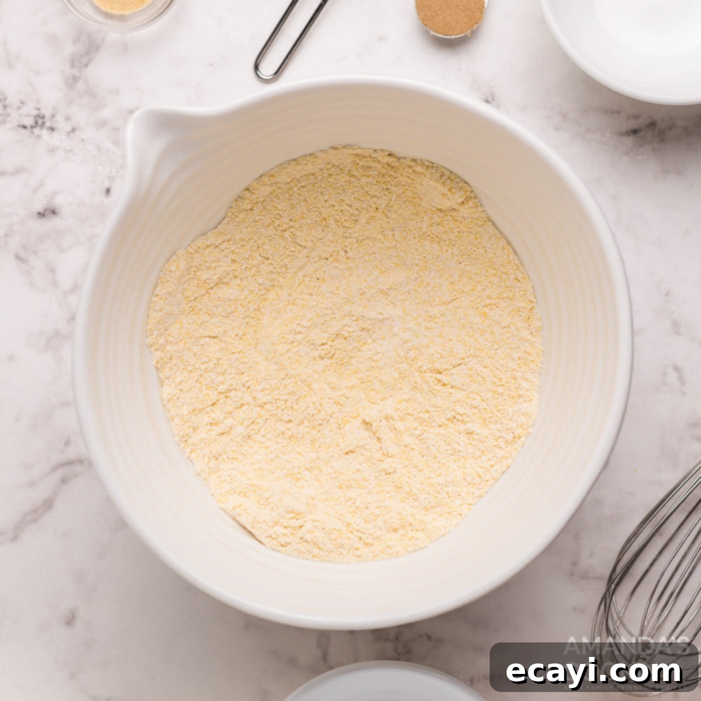 Savory Cornbread Sloppy Joe Bites 5 Cornbread muffin mixture in a large bowl, showing dry ingredients combined