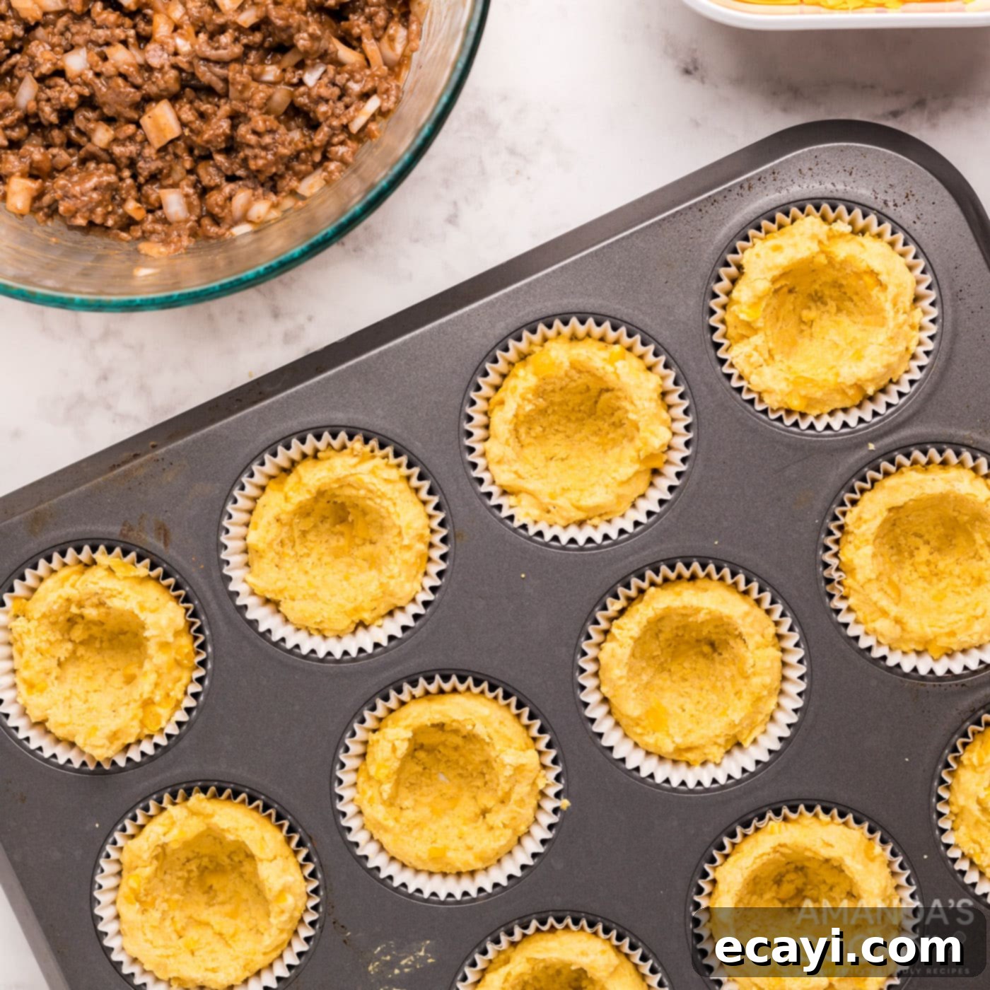 Savory Cornbread Sloppy Joe Bites 10 The center of cornbread muffins carefully removed in a muffin tin to create bowls
