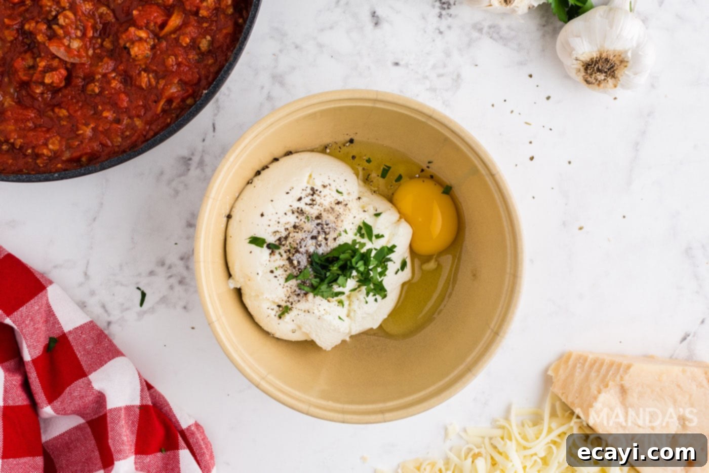 Effortless Crockpot Lasagna 6 ricotta, egg and seasoning in a bowl