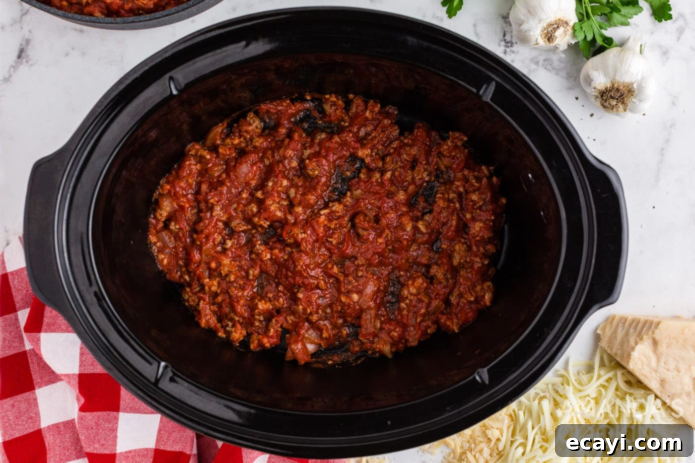 Effortless Crockpot Lasagna 7 meat sauce in bottom of crockpot