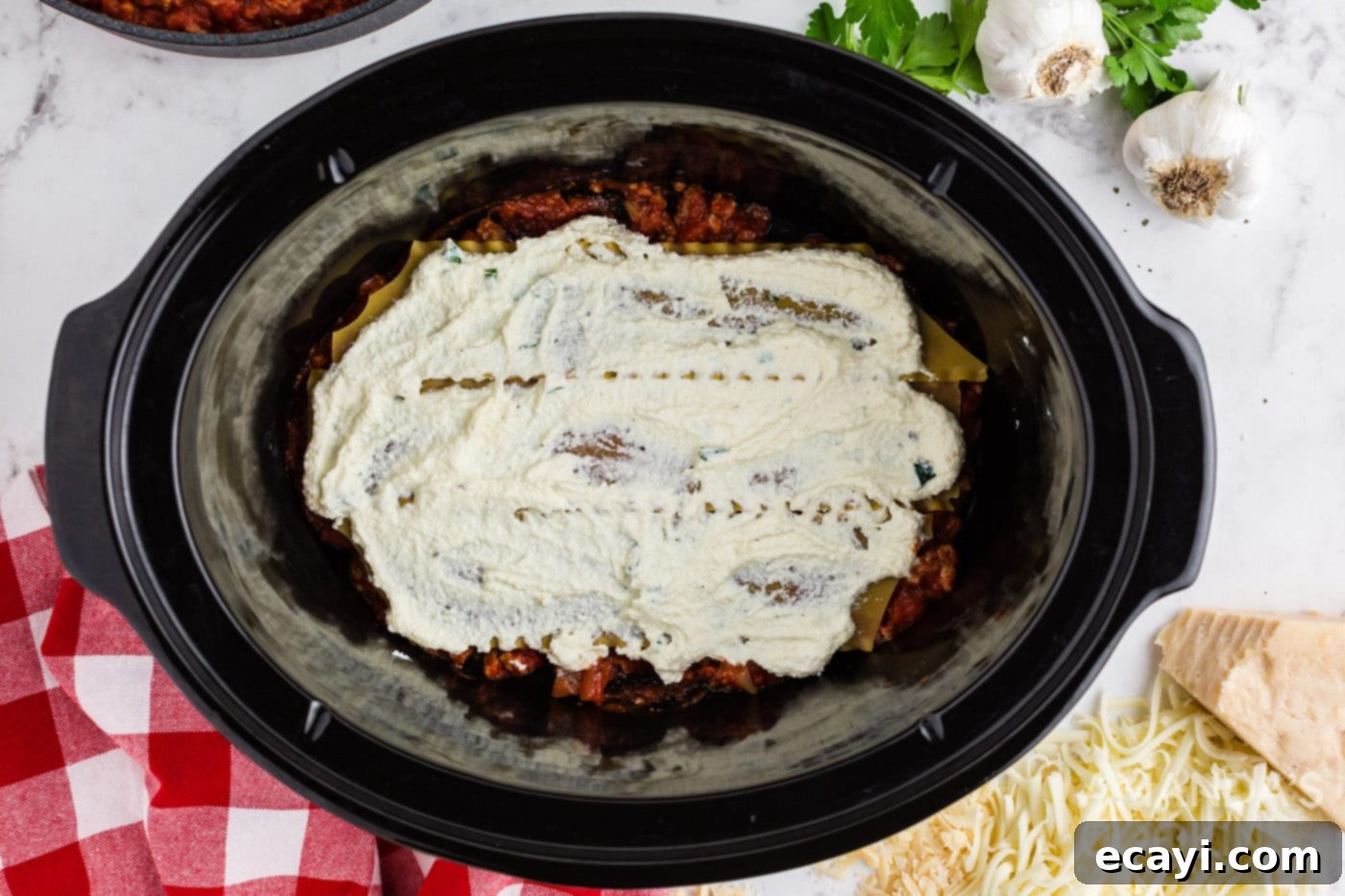 Effortless Crockpot Lasagna 9 ricotta mixture on top of lasagna noodles