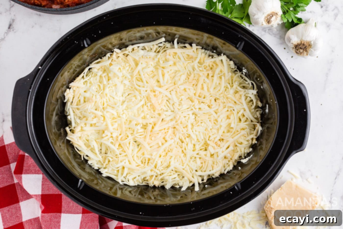 Effortless Crockpot Lasagna 10 layer of mozzarella cheese in crockpot