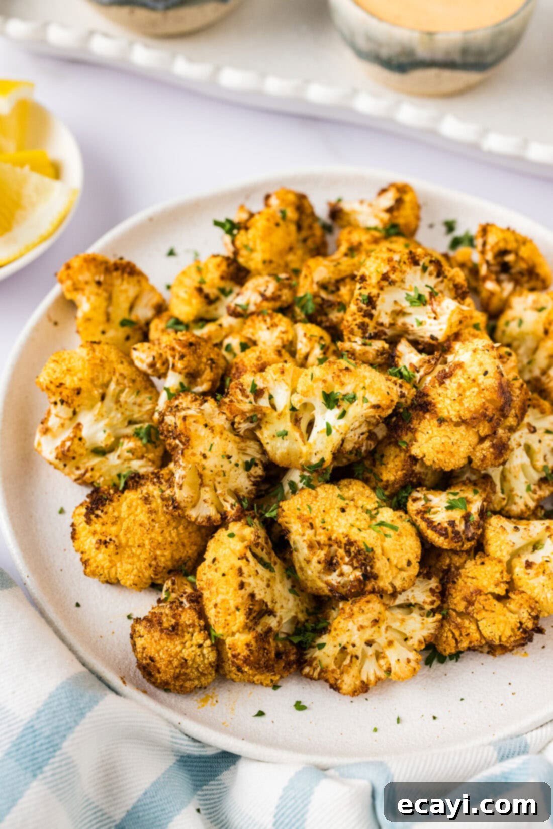 Crispy Air Fryer Cauliflower 3 Close up photo of Air Fryer Cauliflower on a plate